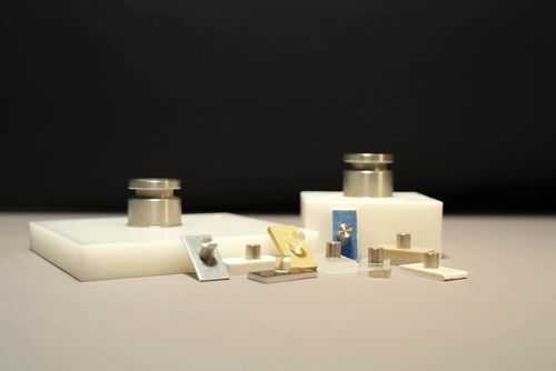 The picture shows adhesive composite test samples of different materials and different shapes.