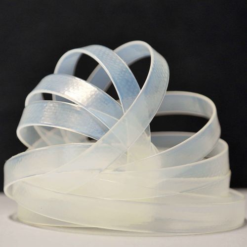 Photo of an extruded strand of transparent plastic.