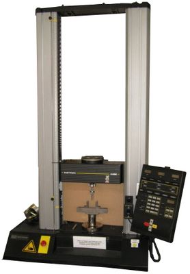 The picture shows the universal testing machine Instron 4469 with three point bending tool.