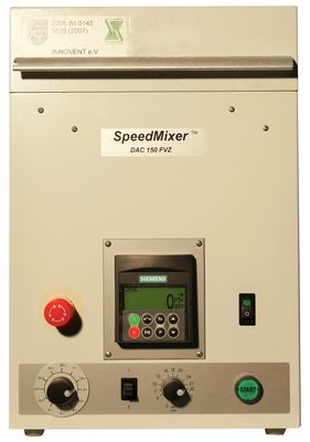 The picture shows the front view of the Speedmixer. You can see the controls for setting the speed and the mixing time. The control has a display for the current speed.