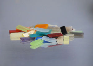 The picture shows different coloured miniature samples before finishing.