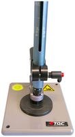 Ball impact tester: A detailed view of the impact table is shown. The picture shows the impact table where the sample to be tested is placed. The sample is located in the slotted tube and is hit by the falling weight and pressed against the sample. A spirit level is built into the impact table so that the tester can be aligned.