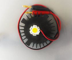 A top view shows the connection of an aluminum heat sink to a high-power LED using the developed heat dissipation material.