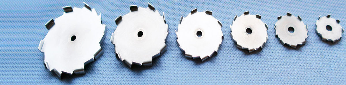 The picture shows an arrangement of dispersing discs of 80 mm to 25 mm diameter arranged according to size