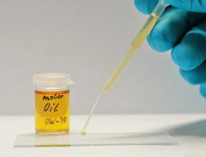 A moving GIF shows the application of oil to a partially oleophobized glass substrate.